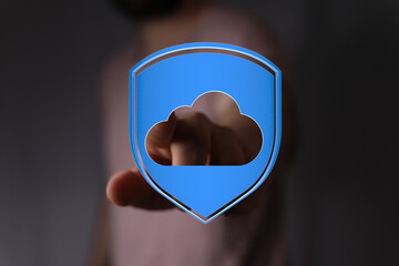 Secure cloud computing data protection concept. Hand holding digital cloud with shield, represents...