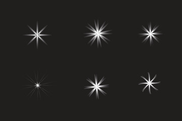 Bright Starburst Light Effects Set on Dark Background — Sparkle Glow Elements