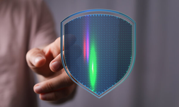 Concept of cybersecurity with a digital shield representing protection and secure data transfer. The image portrays network security,