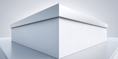 Minimalist white box with clean lines set against a simple background showcasing modern design aesthetic
