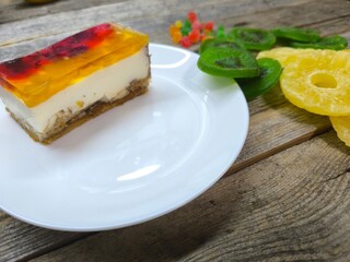piece of honey-fruit cake on a plate. View from above. High quality photos