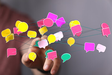 Abstract image representing communication, social networking, and digital connections. Speech bubbles connect,