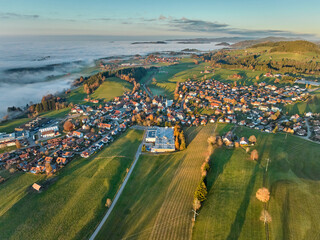 Aerial photo at sunset of the village of Weiler-Simmerberg, district Simmerberg in the western Allgaeu in Bavaria, Germany