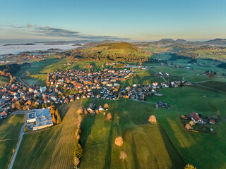 Aerial photo at sunset of the village of Weiler-Simmerberg, district Simmerberg in the western Allgaeu in Bavaria, Germany