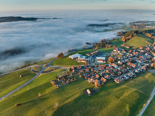 Aerial photo at sunset of the village of Weiler-Simmerberg, district Simmerberg in the western Allgaeu in Bavaria, Germany