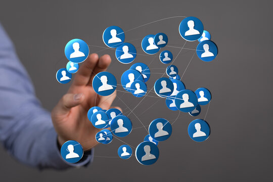 Hand holding digital network of people symbolizing community connection and global interaction. Perfect for social media, teamwork, and business