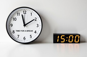 Clock showing time for a break with a digital timer displaying 15:00 on a plain background
