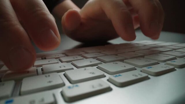 Time lapse close-up man typing on computer keyboard with fingers. Macro soft focus dolly shot. Computer programming, text chat online messaging and online marketing business hyperlapse concept. Glean