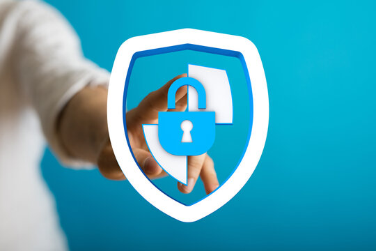 Secure digital safety concept with hand touching digital shield icon and padlock symbol, safeguarding data and personal information.