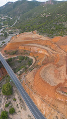 Ruins of the Monteponi Mining District with Red Waste Deposits