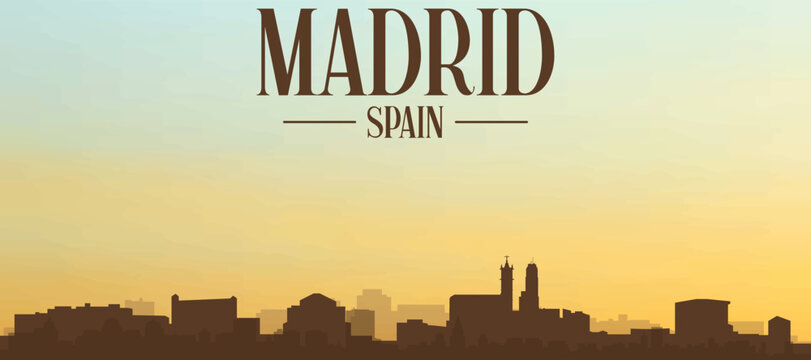 Panoramic poster of the city skyline with misty background buildings, hills sunrise, sunset and clouds of MADRID, SPAIN