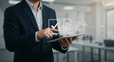 Professional manager using tablet to review digital documents and tasks, showcasing efficient workflow and modern office technology for business success.