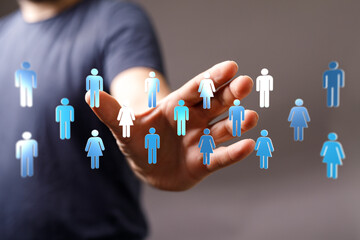 Hand reaching out to human icons representing global community, networking, social media, connection, teamwork,