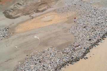 Natural art with rocks in the sand, zen and harmony with nature, aerial photo.