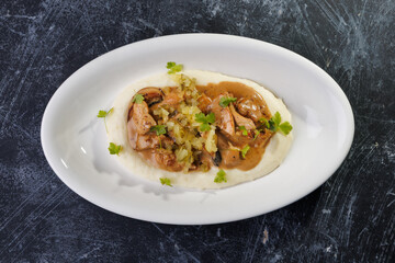 Creamy Mashed Potatoes With Chicken in Mushroom Sauce and Herb Garnish