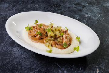 Creamy Mashed Potatoes With Chicken in Mushroom Sauce and Herb Garnish