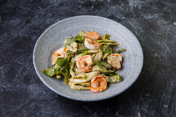Shrimp Salad with Fresh Herbs on a Gray Plate