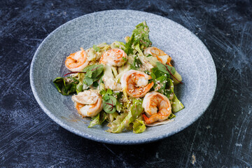 Shrimp Salad with Fresh Herbs on a Gray Plate
