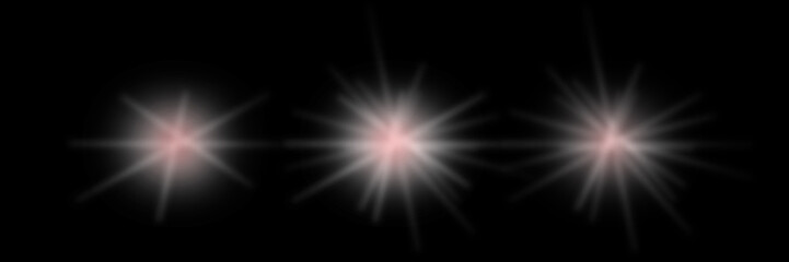 Three Soft White and Pink Lens Flares on Black