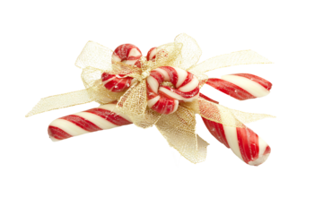 Candy cane pair with red and white spiral stripes tied with a ribbon isolated on a transparent background 