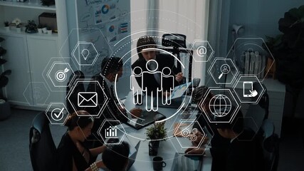 A diverse group of business professionals engages in collaboration at a table, surrounded by digital interface symbols representing communication and analysis. Raster - Powered by Adobe