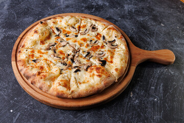 Gourmet Mushroom Cheese Pizza On Circular Wooden Board