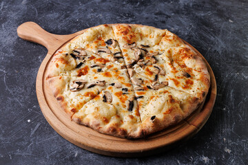 Gourmet Mushroom Cheese Pizza On Circular Wooden Board