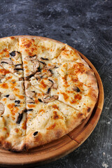 Gourmet Mushroom Cheese Pizza On Circular Wooden Board