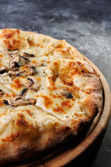 Gourmet Mushroom Cheese Pizza On Circular Wooden Board