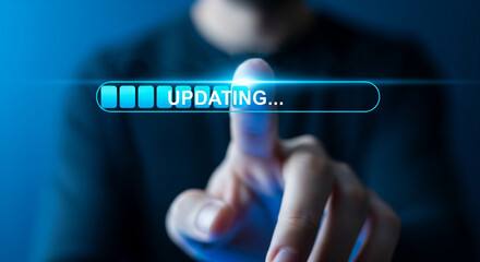 A finger touching a blue updating bar on a screen with a blurred background and a glow effect
