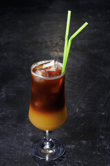Iced Coffee Layered Drink in Glass with Green Straws