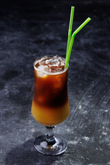 Iced Coffee Layered Drink in Glass with Green Straws