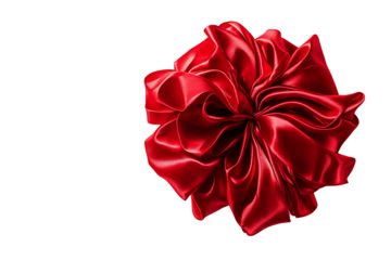 Red Christmas bow with satin texture and elegant folds isolated on a transparent background 