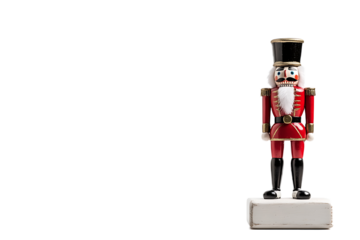 Traditional Christmas nutcracker figure with red uniform and black boots isolated on transparent background 