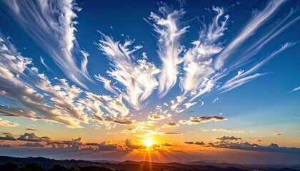 white particle clouds floating across the sky at sunrise