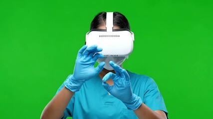 Woman using virtual reality headset in medical field vr healthcare simulation green screen - Powered by Adobe