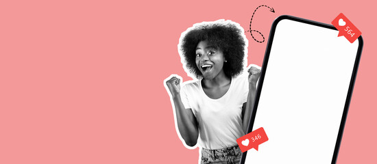 A joyful woman with curly hair raises her fists in excitement near a blank smartphone screen. She is celebrating high social media likes in a vibrant pink setting.