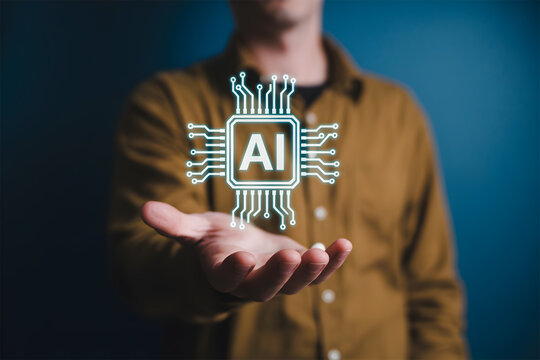 Man holding out hand with glowing AI chip icon representing artificial intelligence technology