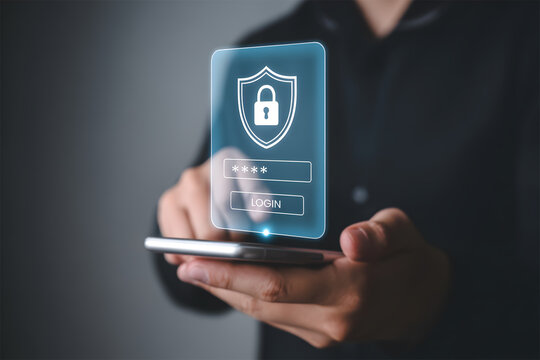 Man holding phone with secured login interface, shield icon, and padlock for data security - Powered by Adobe