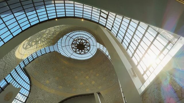 Interior architectural detail windows backlit by sunset sun of the DITIB Central Mosque in Cologne, Germany