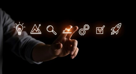 Hand interacting with digital icons representing business growth and project planning, conceptualizing progress and development