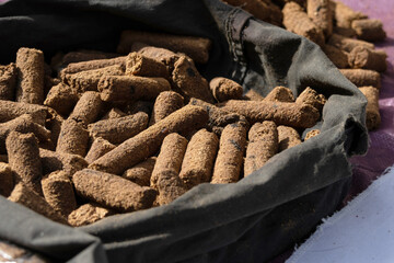 a large quantity of cigar-like incense pieces inside a bag