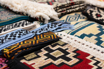 Close-up image showing various woolen garments with different pattern designs.
