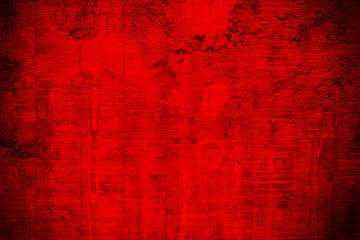 Old cracked red concrete wall in closeup as Christmas background.