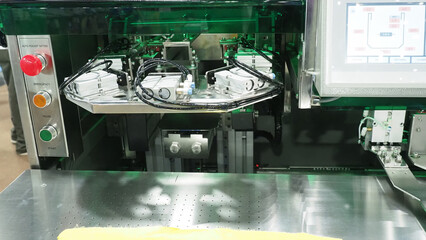 An industrial automated machine in garment manufacturing.