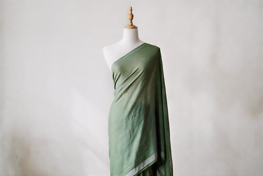 Green Draped Fabric on Mannequin – Elegant Textile Display for Fashion Design