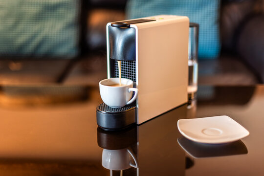 Morning fragrant coffee with coffee machine. Espresso coffee machine which make the cup of morning coffee, cosy living room background