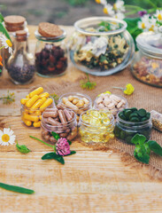 Supplementi and medicinal herbs and flowers. Selective focus.
