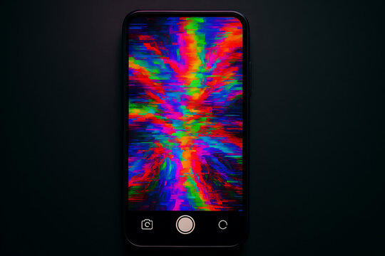 Smartphone display showing multicolor glitch distortion pattern indicating severe screen malfunction digital corruption visual noise error unstable display issue hardware failure