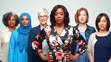 Diverse group of women standing together with hands on hips looking forward
